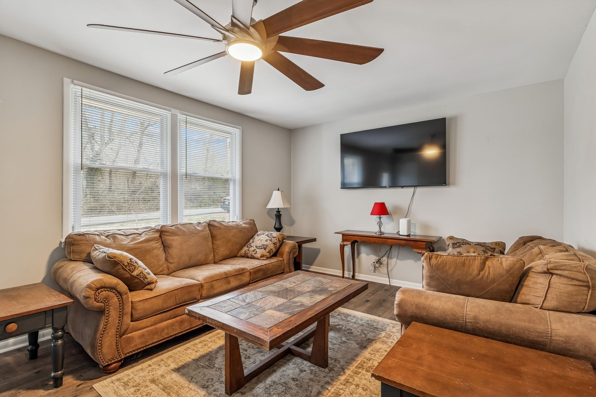 8871 Pinewood Road Lyles, TN 37098 - Photo 5 of 35 a living room with furniture and a flat screen tv