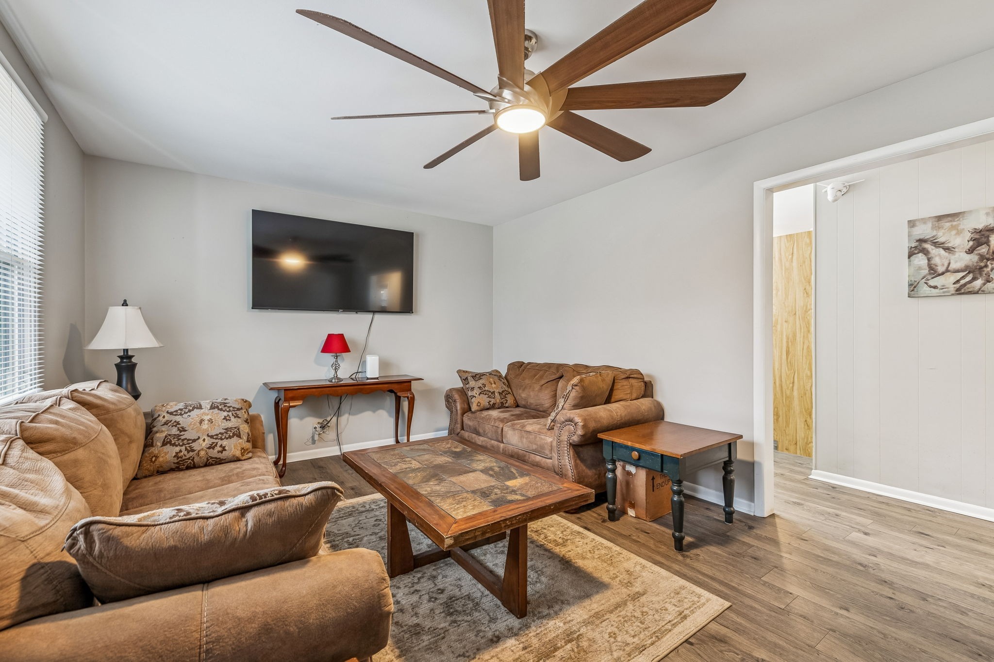 8871 Pinewood Road Lyles, TN 37098 - Photo 6 of 35 a living room with furniture and a flat screen tv