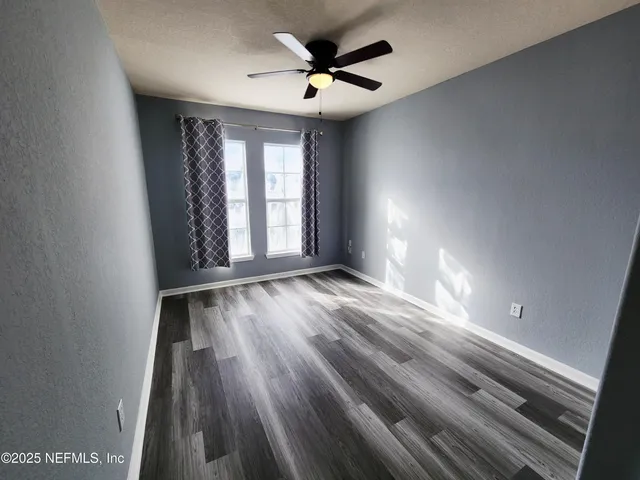a bathroom with a sink a toilet a tub and shower