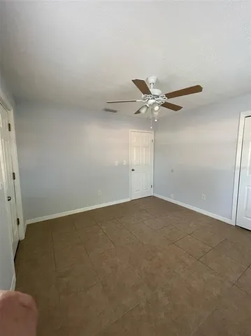 a white toilet sitting next to a bath tub