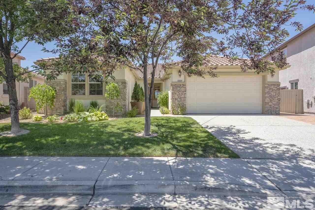 10669 Fire Poppy Circle Reno, NV 89521 - Photo 1 of 24 a front view of a house with garden