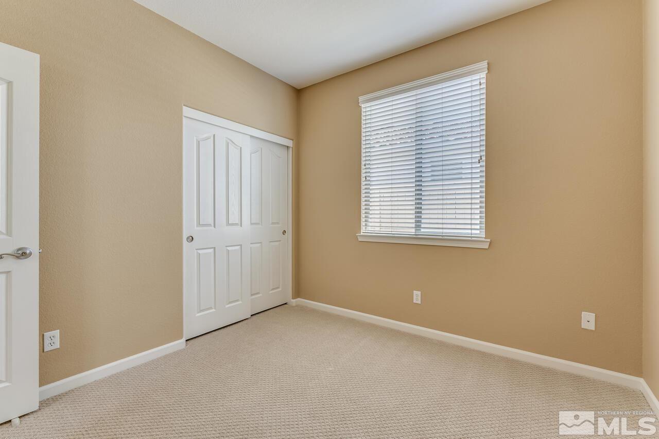 10669 Fire Poppy Circle Reno, NV 89521 - Photo 11 of 24 an empty room with windows
