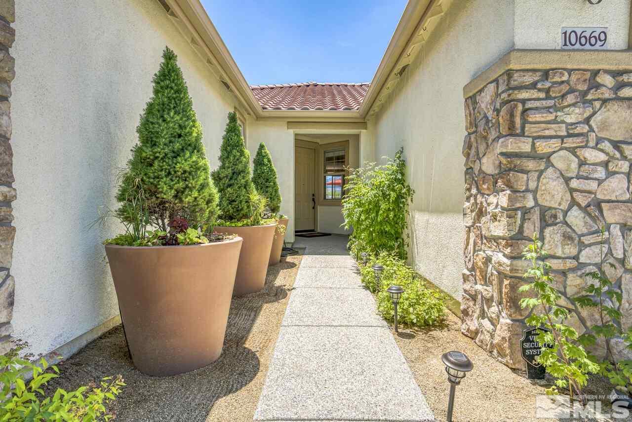 10669 Fire Poppy Circle Reno, NV 89521 - Photo 2 of 24 front view of a house with a potted plant