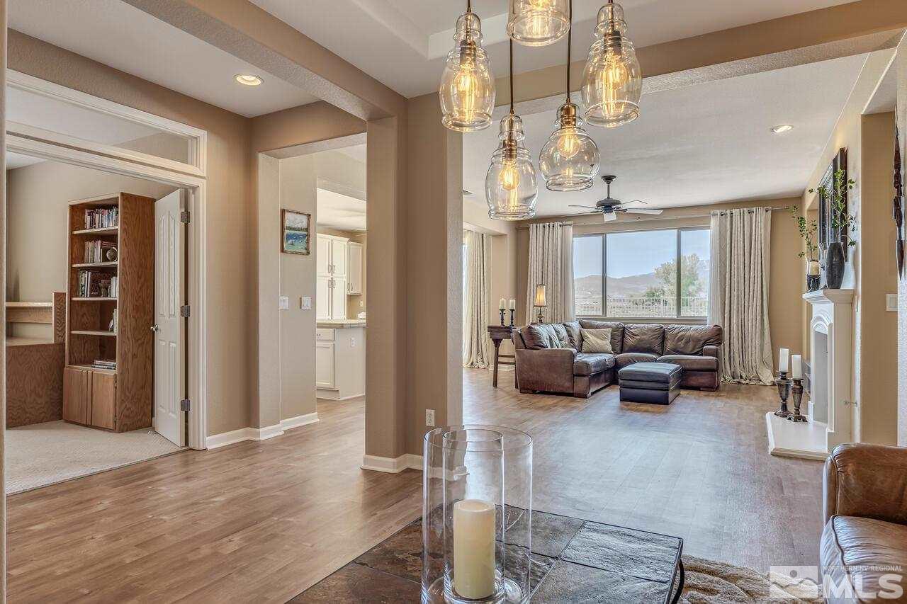 10669 Fire Poppy Circle Reno, NV 89521 - Photo 5 of 24 a living room with furniture or couch and a large window