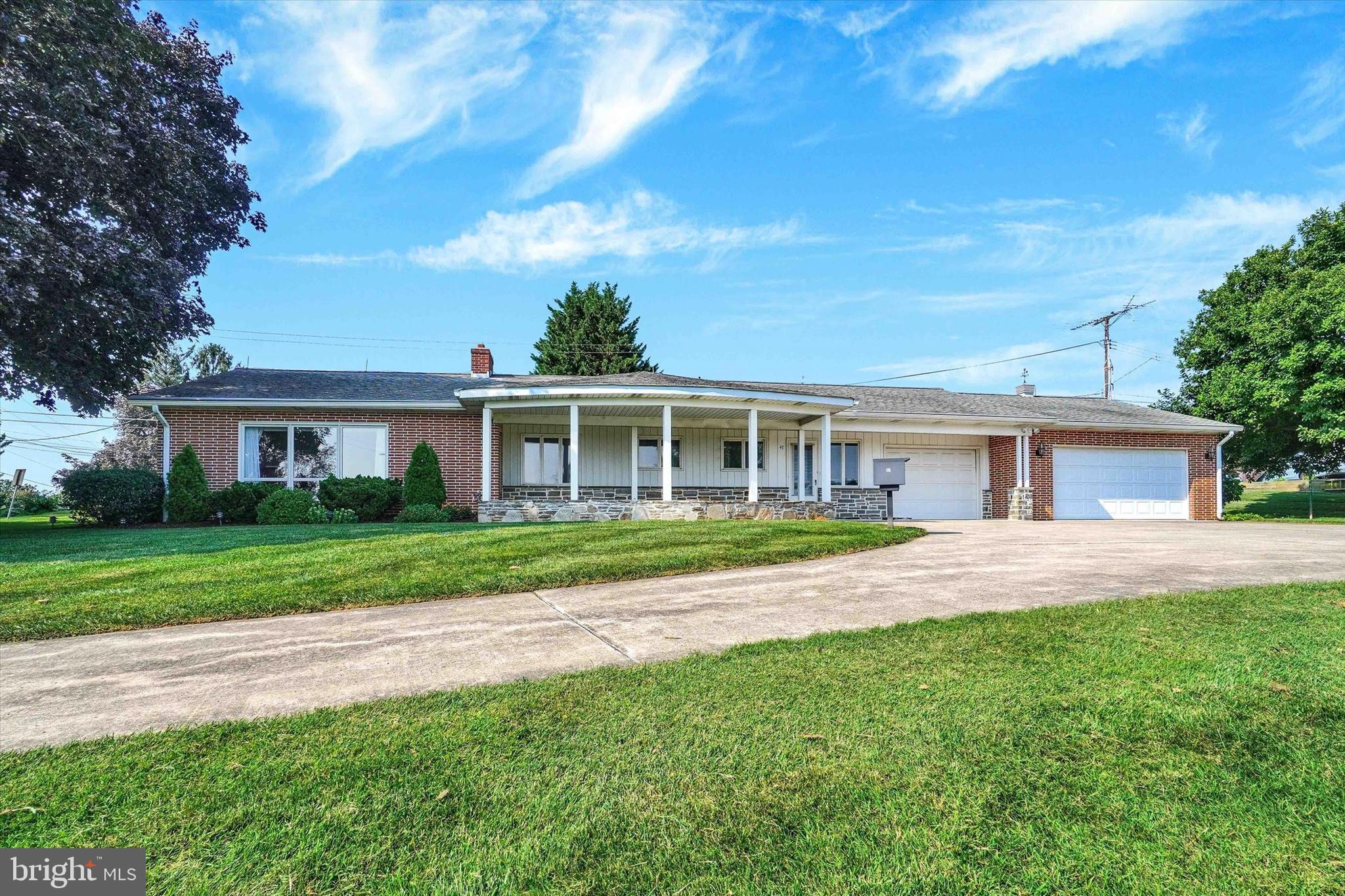 47 Rocks Road Fawn Grove, PA 17321 - Photo 1 of 29 a view of house in front of a big yard with large trees