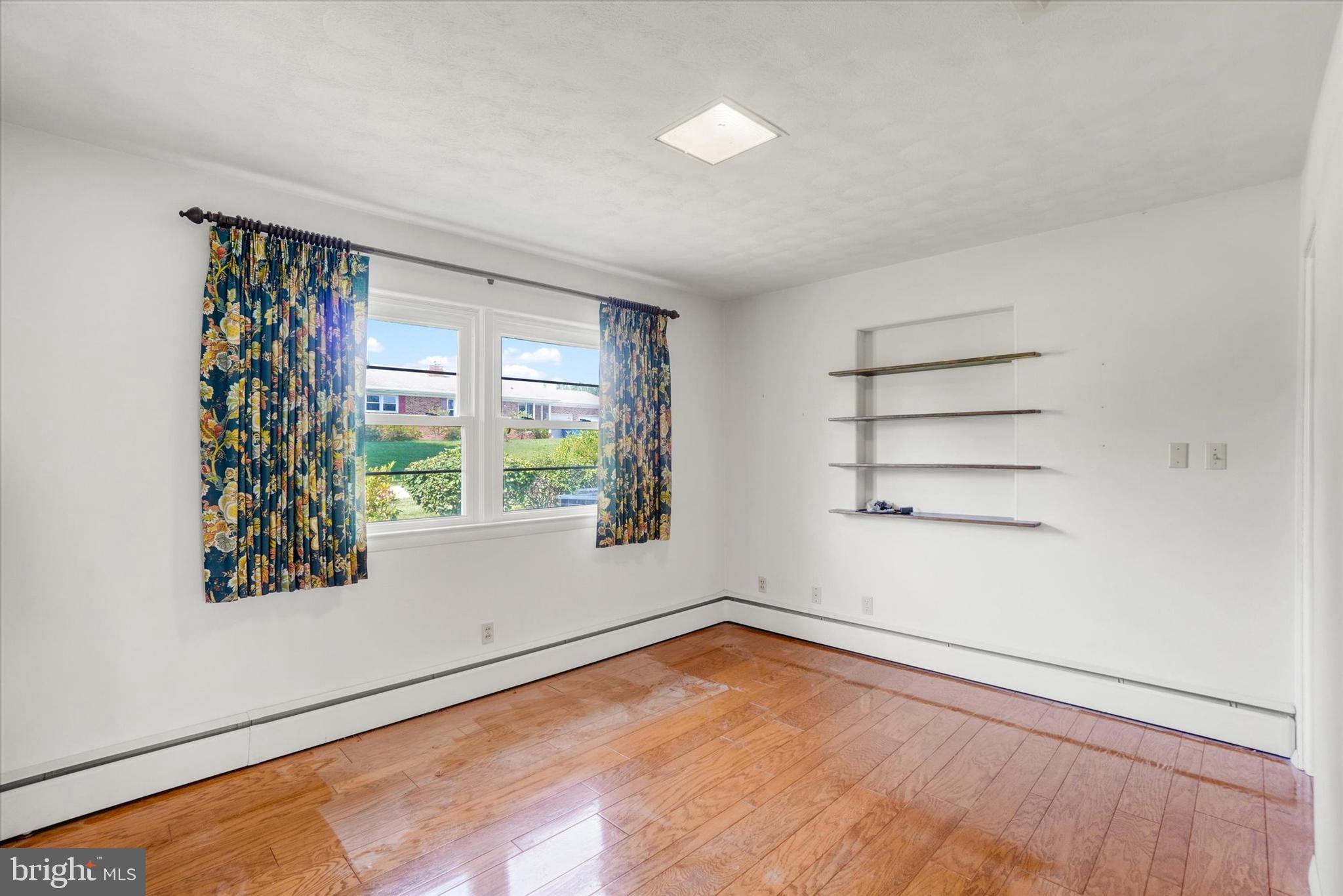 47 Rocks Road Fawn Grove, PA 17321 - Photo 13 of 29 wooden floor in an empty room with a window