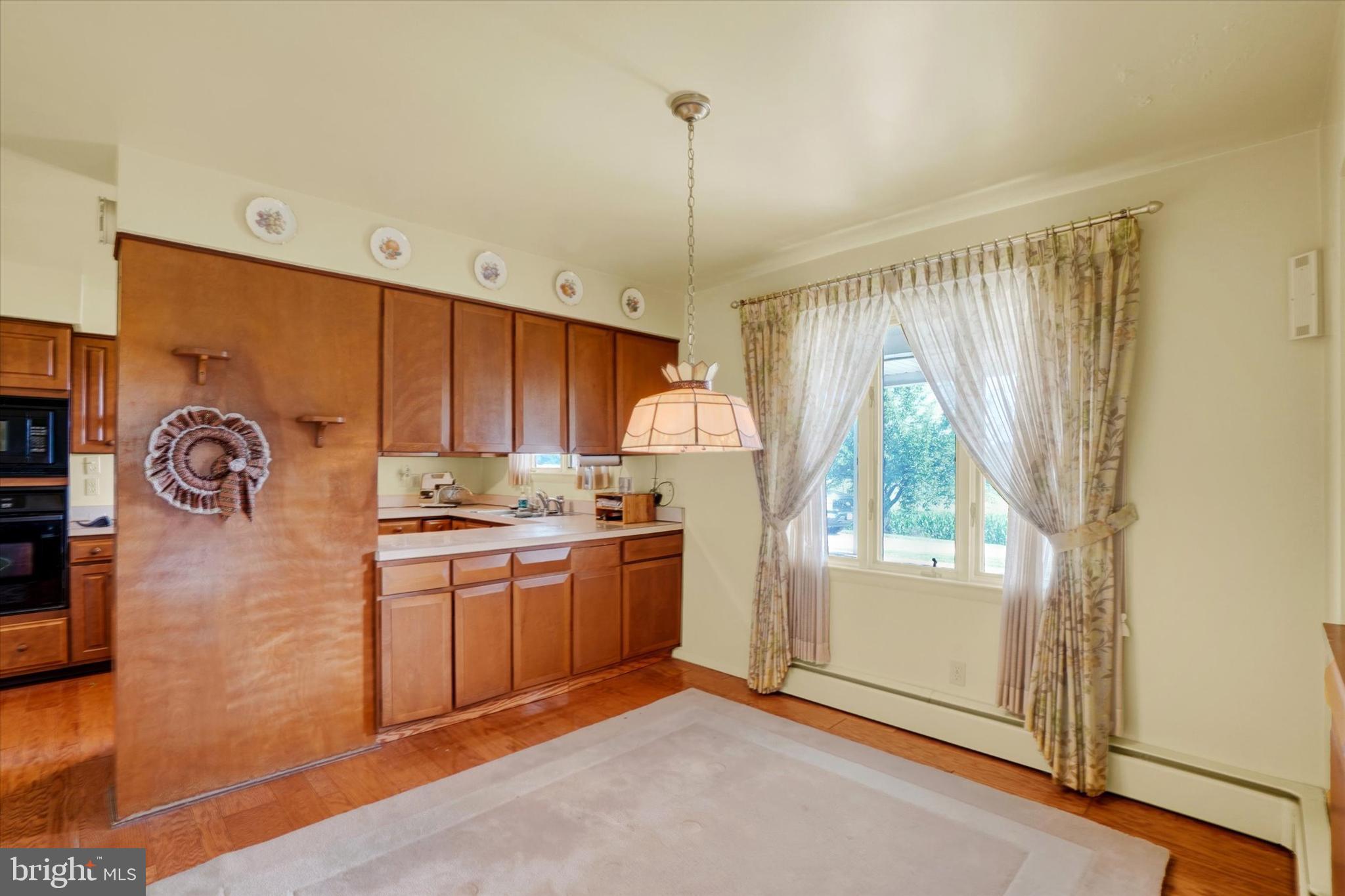 47 Rocks Road Fawn Grove, PA 17321 - Photo 8 of 29 a kitchen with granite countertop a stove a sink and a refrigerator