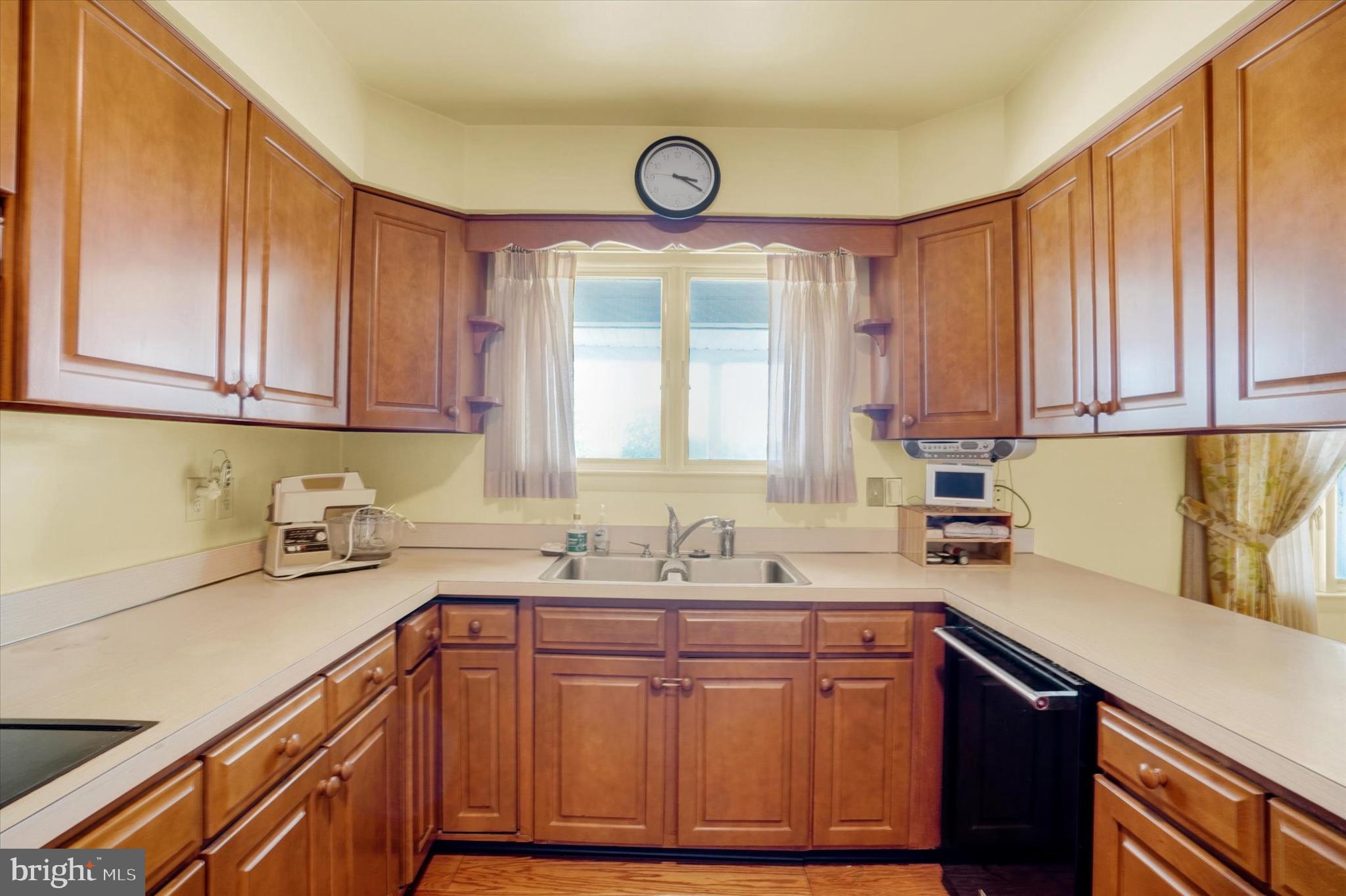 47 Rocks Road Fawn Grove, PA 17321 - Photo 10 of 29 a kitchen with stainless steel appliances granite countertop a sink a stove cabinets and a window