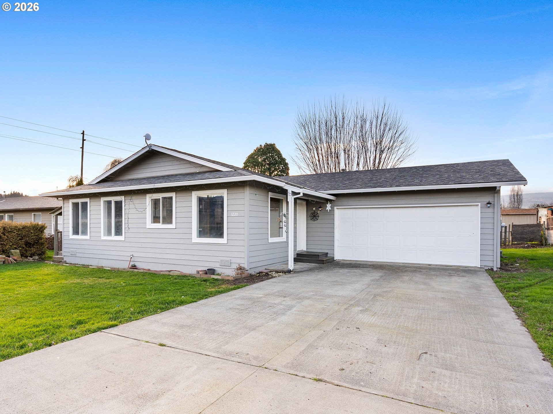 3220 Midway Road Hood River, OR 97031 - Photo 12 of 39 a front view of a house with a garden and yard