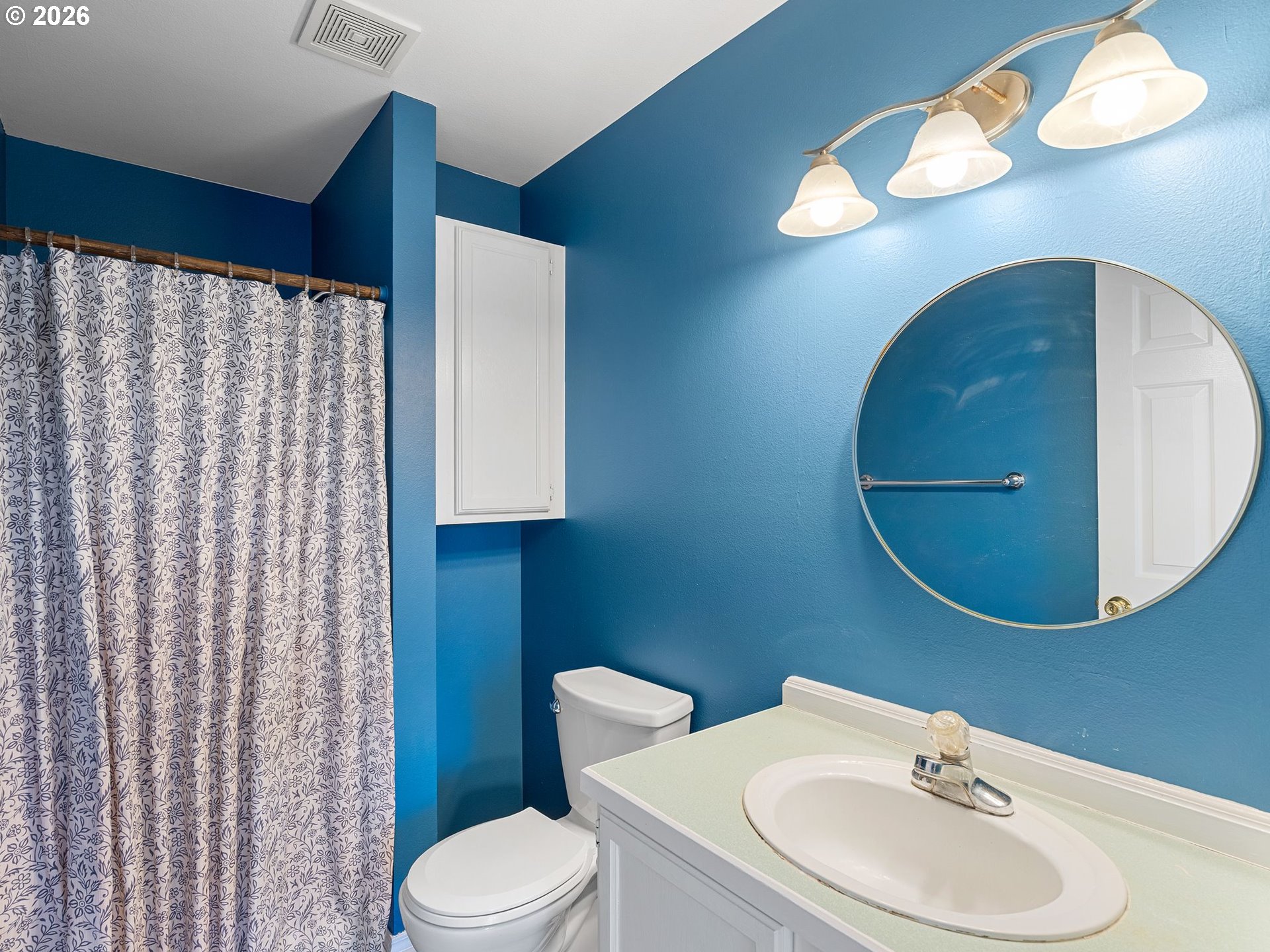 3220 Midway Road Hood River, OR 97031 - Photo 21 of 39 a bathroom with a sink a toilet and mirror