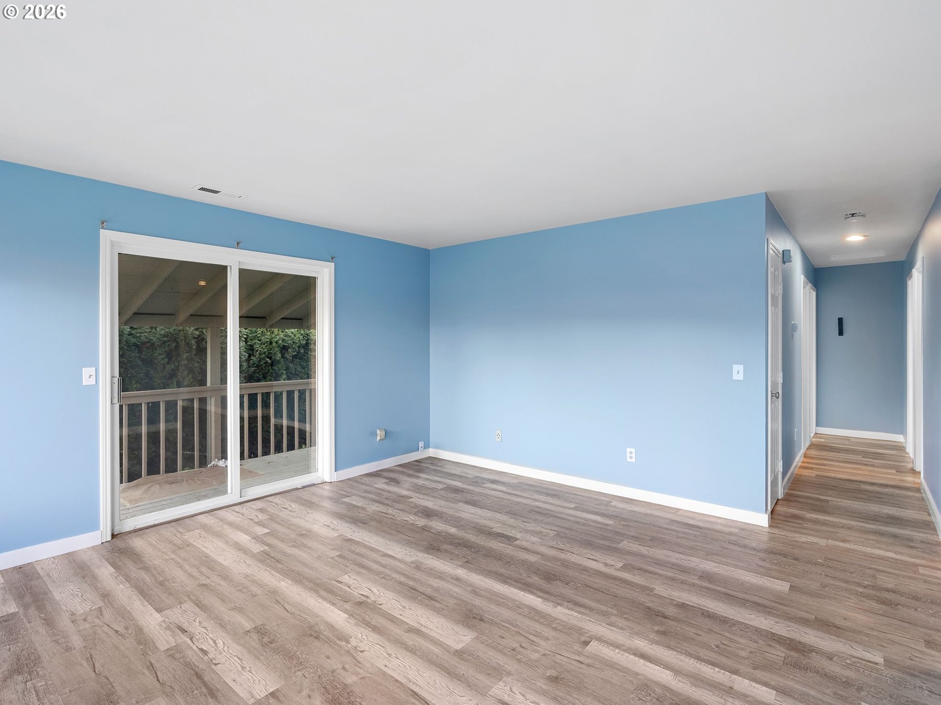 3220 Midway Road Hood River, OR 97031 - Photo 9 of 39 a view of empty room with wooden floor and fan
