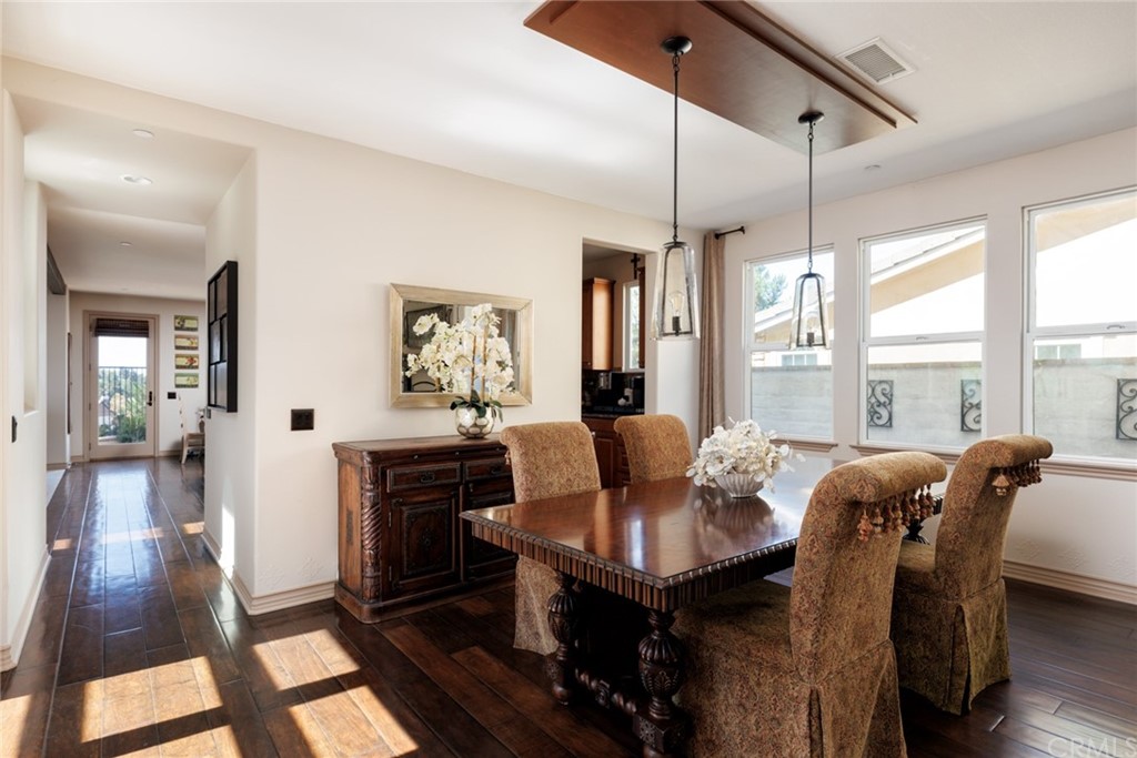 8 Kane Lane Ladera Ranch, CA 92694 - Photo 11 of 29 a view of a dining room with furniture window and wooden floor