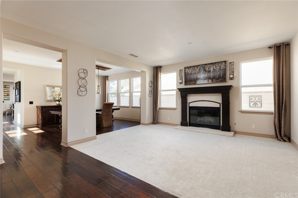 8 Kane Lane Ladera Ranch, CA 92694 - Photo 12 of 29 a living room with furniture and a fireplace