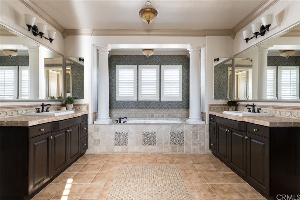 8 Kane Lane Ladera Ranch, CA 92694 - Photo 16 of 29 a spacious bathroom with a double vanity sink a mirror and a bathtub