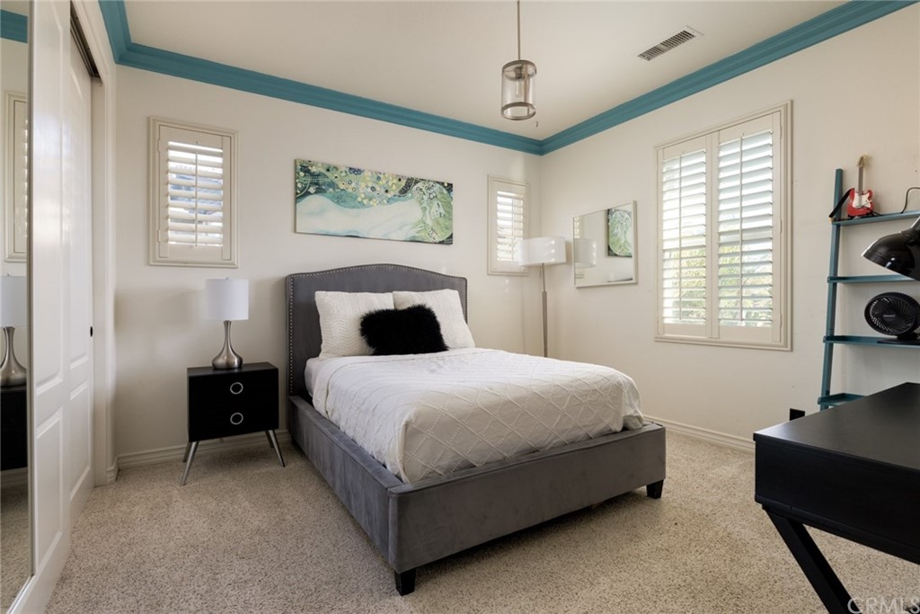 8 Kane Lane Ladera Ranch, CA 92694 - Photo 18 of 29 a bedroom with a bed and a window