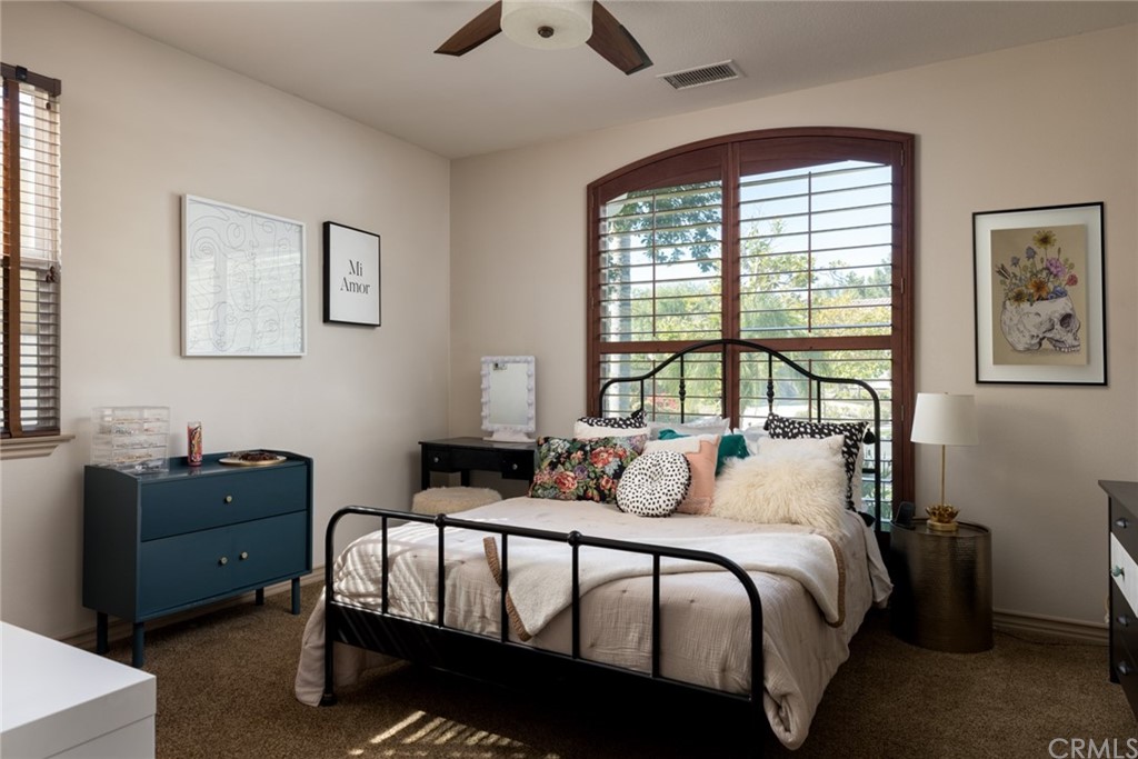 8 Kane Lane Ladera Ranch, CA 92694 - Photo 19 of 29 a bedroom with a bed and a window