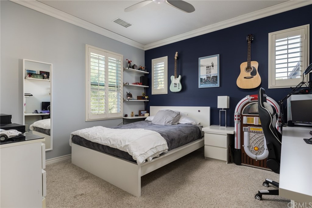 8 Kane Lane Ladera Ranch, CA 92694 - Photo 20 of 29 a living room with a bed furniture and a window