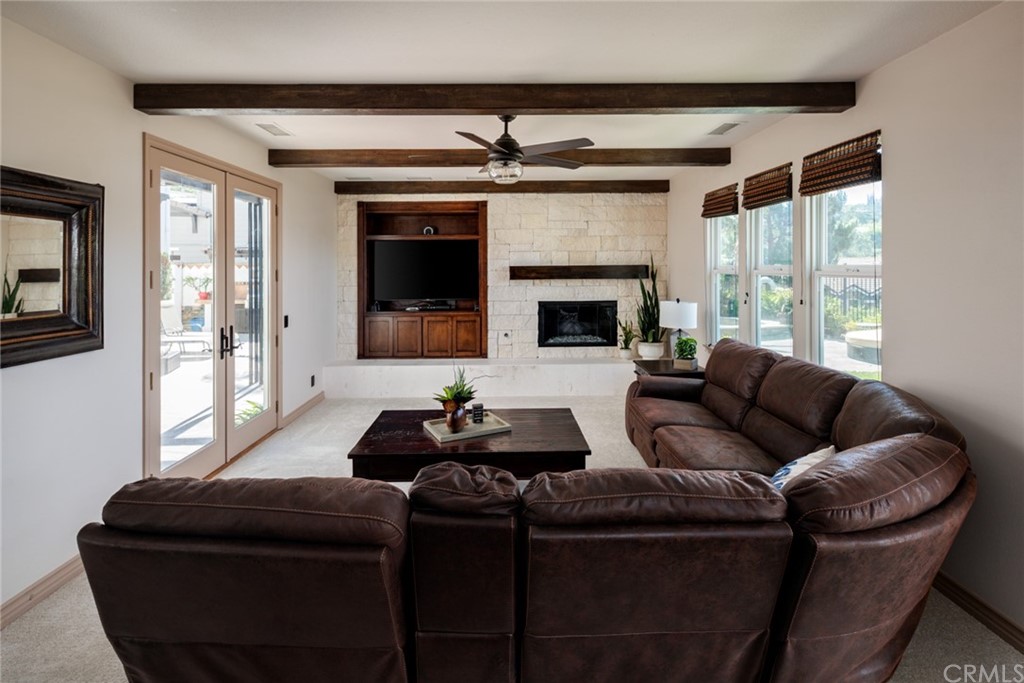 8 Kane Lane Ladera Ranch, CA 92694 - Photo 6 of 29 a living room with furniture and a fireplace