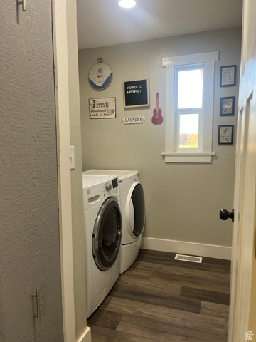 558 North N Cres Road Roosevelt, UT 84066 - Photo 9 of 31 Dedicated laundry room featuring wood-finish flooring, a window with white trim, and a built-in storage cabinet