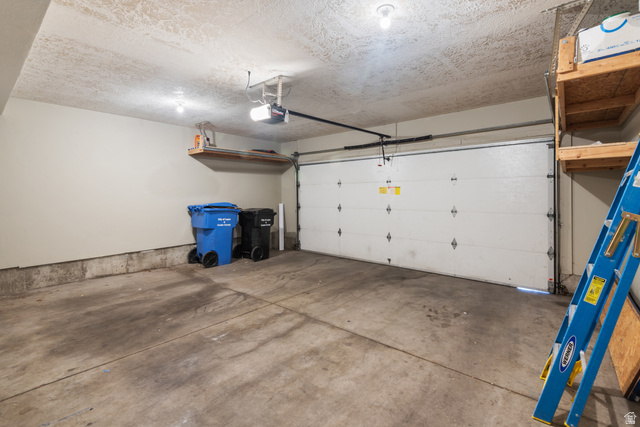 273 West 1010th Street South Logan, UT 84321 - Photo 10 of 19 Garage with a garage door opener