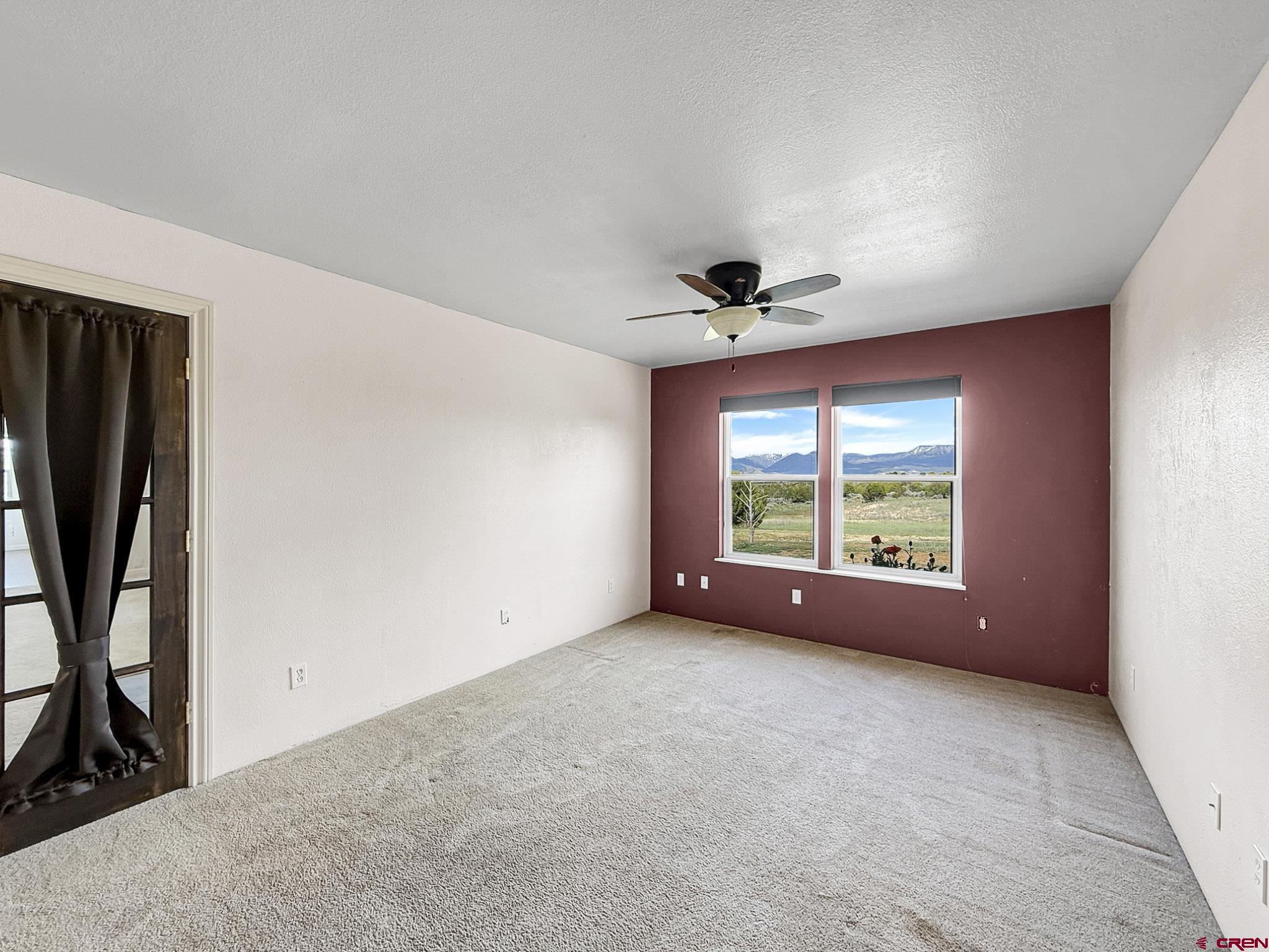 32310 B50 Road Crawford, CO 81415 - Photo 24 of 45 a view of an empty room with a window