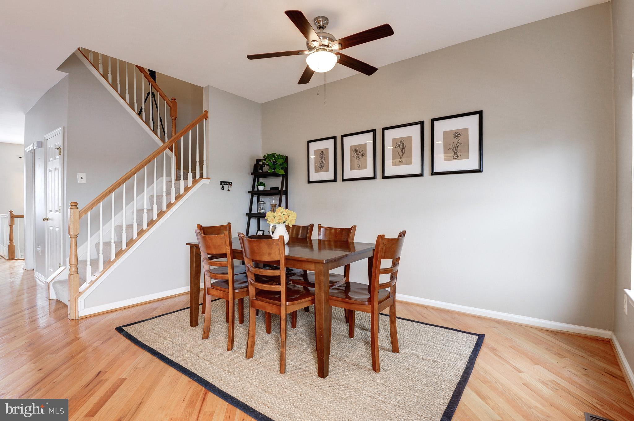 44167 Tippecanoe Terrace Ashburn, VA 20147 - Photo 15 of 56 a view of a dining room with furniture and wooden floor