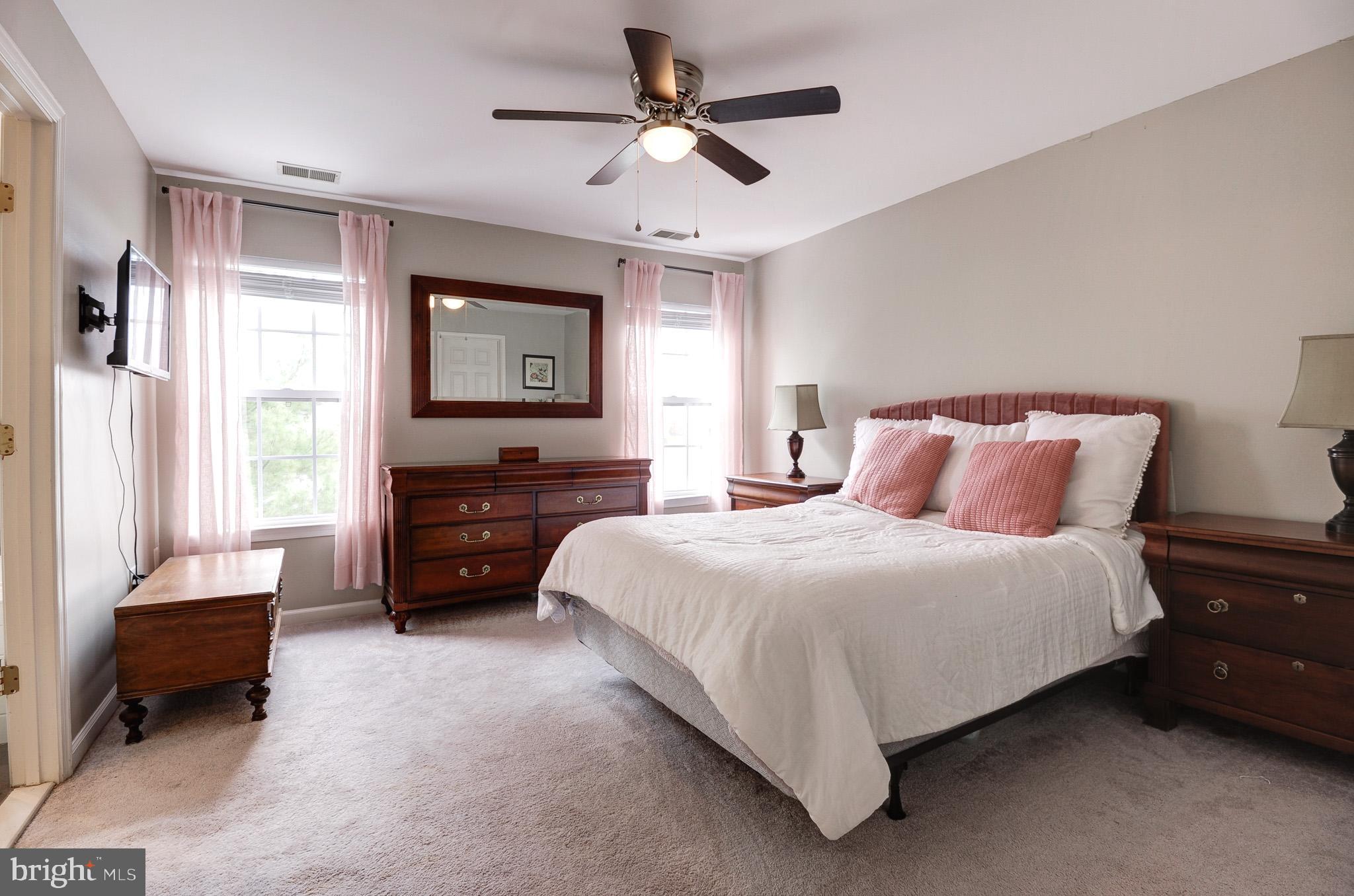 44167 Tippecanoe Terrace Ashburn, VA 20147 - Photo 22 of 56 a bedroom with a bed and a couch