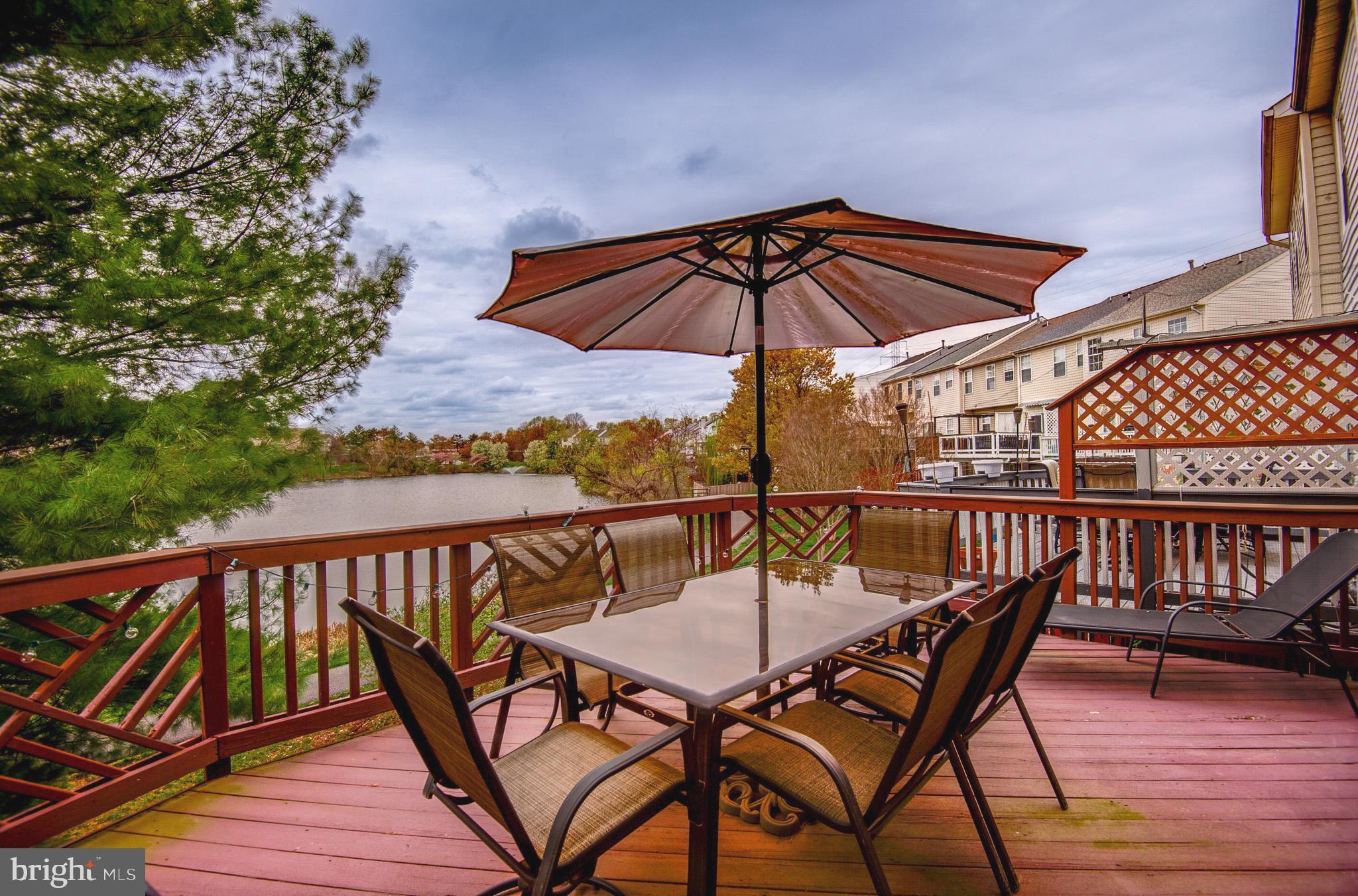 44167 Tippecanoe Terrace Ashburn, VA 20147 - Photo 3 of 56 a view of balcony with wooden floor and outdoor seating