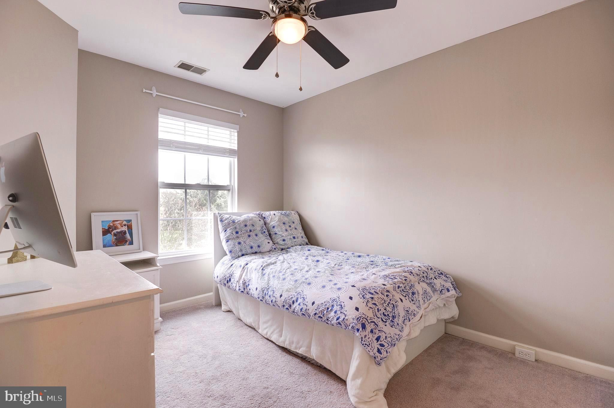 44167 Tippecanoe Terrace Ashburn, VA 20147 - Photo 32 of 56 a bedroom with a bed and a flat screen tv