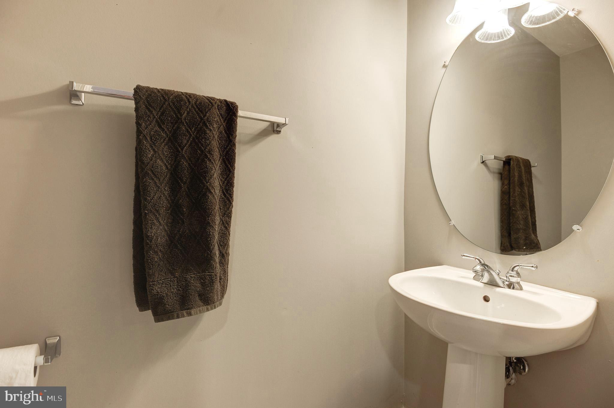 44167 Tippecanoe Terrace Ashburn, VA 20147 - Photo 39 of 56 a bathroom with a sink and a mirror