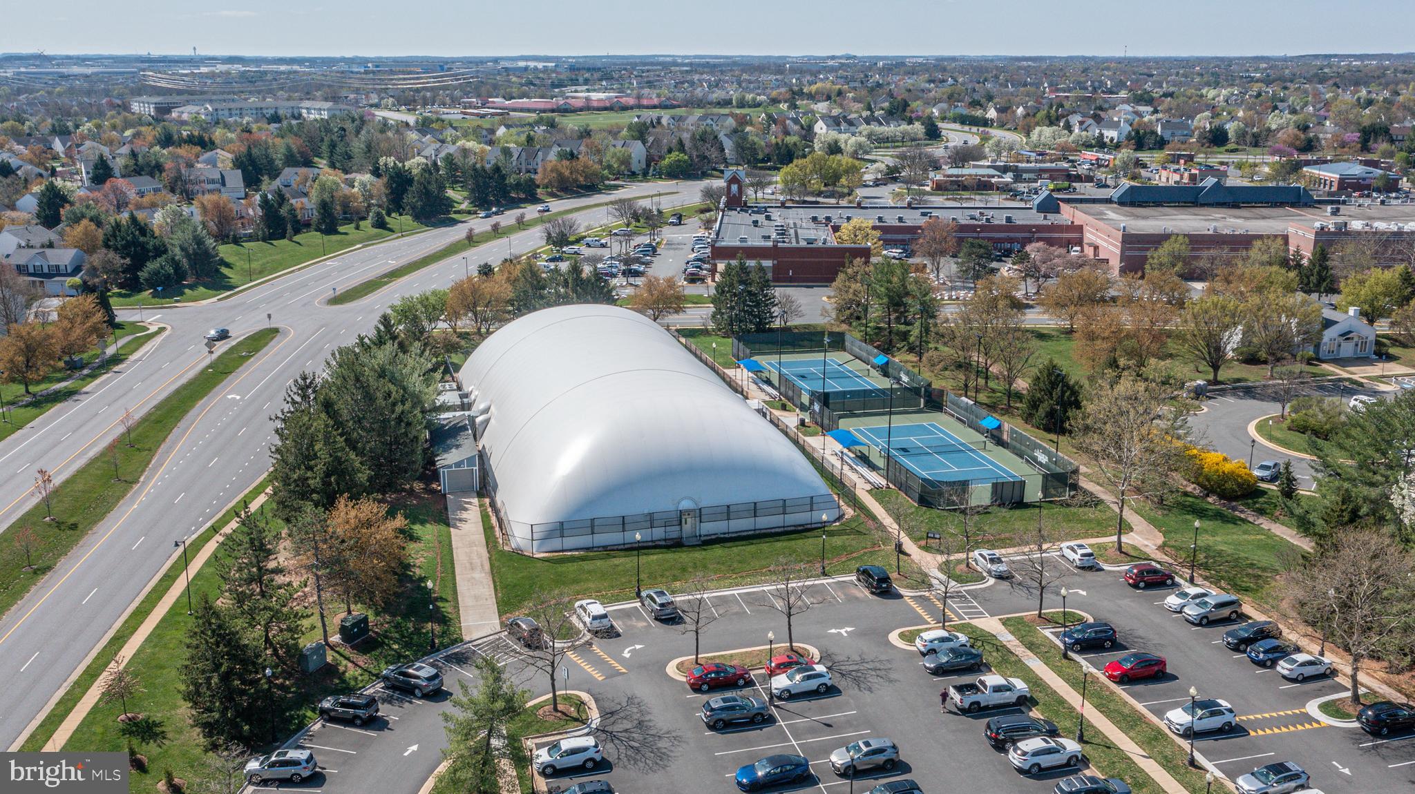 44167 Tippecanoe Terrace Ashburn, VA 20147 - Photo 45 of 56 an aerial view of a house with a garden and lake view