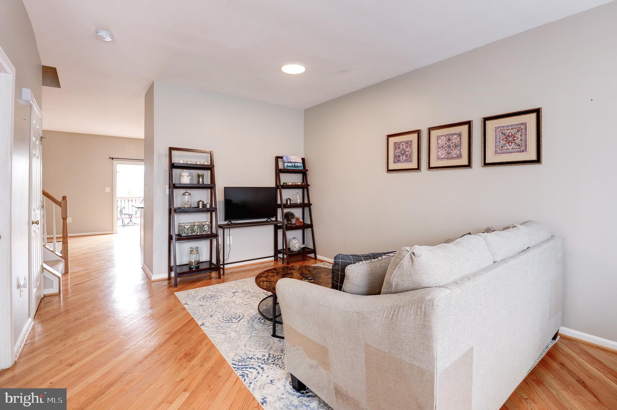 44167 Tippecanoe Terrace Ashburn, VA 20147 - Photo 7 of 56 a living room with furniture and wooden floor