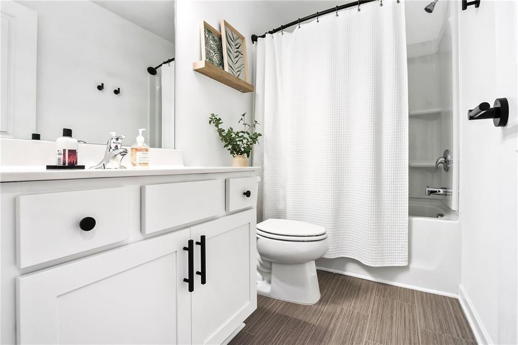 1363 Cooper Springs Road Grayson, GA 30017 - Photo 18 of 28 a bathroom with a sink a toilet and shower