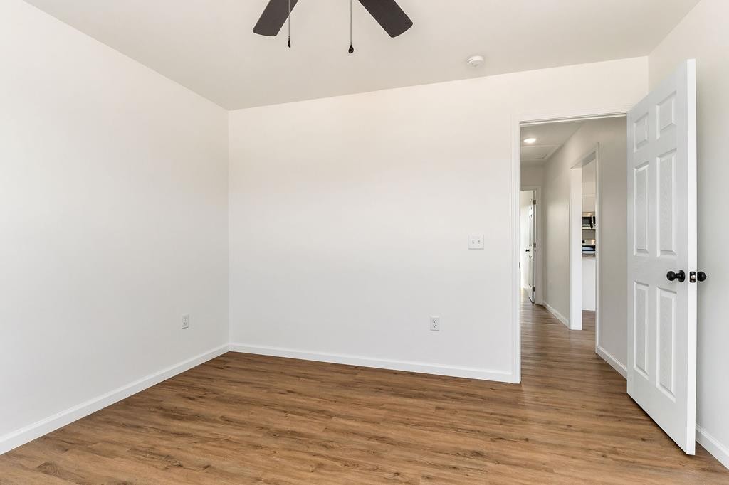 523 Dr I C Morgan Road Spencer, TN 38585 - Photo 12 of 25 a view of an empty room with wooden floor