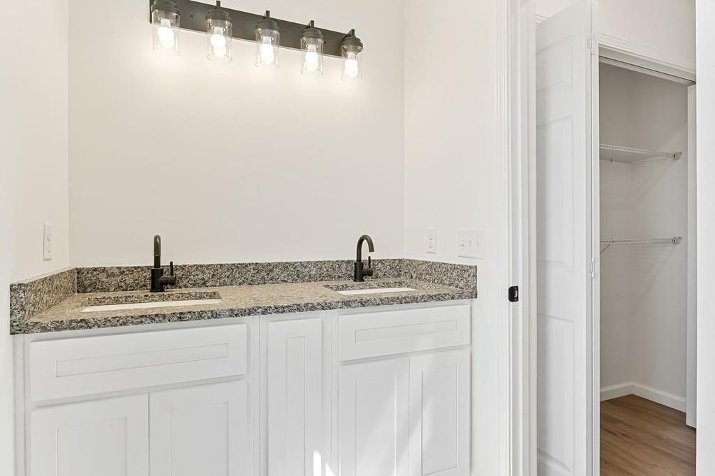 523 Dr I C Morgan Road Spencer, TN 38585 - Photo 18 of 25 a bathroom with a granite countertop sink and a mirror