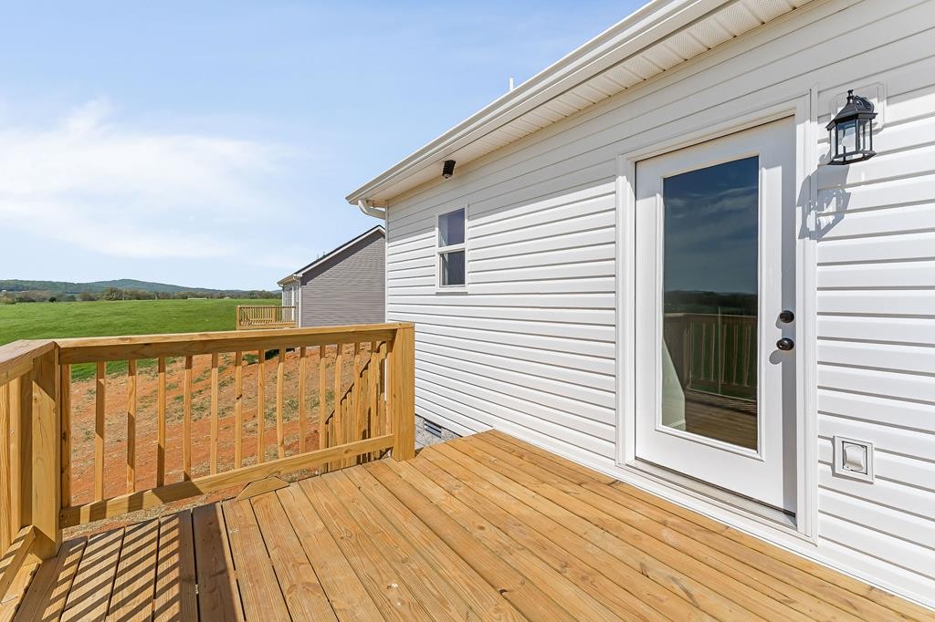 523 Dr I C Morgan Road Spencer, TN 38585 - Photo 19 of 25 a view of a balcony with wooden floor