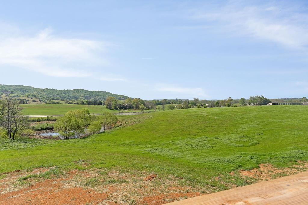 523 Dr I C Morgan Road Spencer, TN 38585 - Photo 20 of 25 a view of a lake with houses in the back