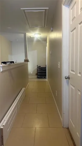 a bathroom with a shower and a mirror