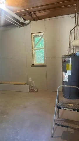 a room with a wooden floor and a sink