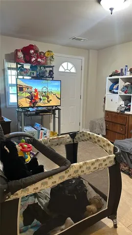 a room with furniture and flat screen tv