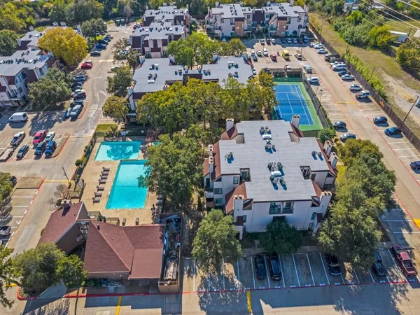 an aerial view of residential houses with outdoor space