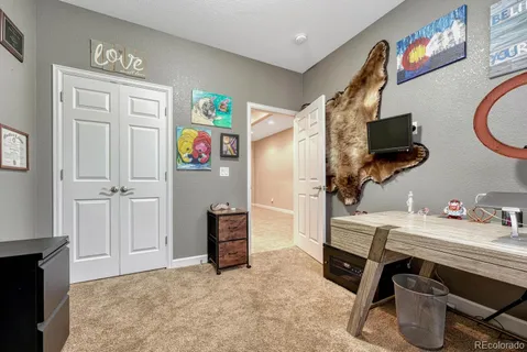 a bedroom with furniture and a window