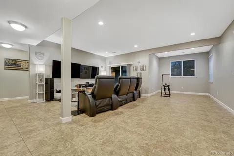 a view of a livingroom with furniture and a flat screen tv