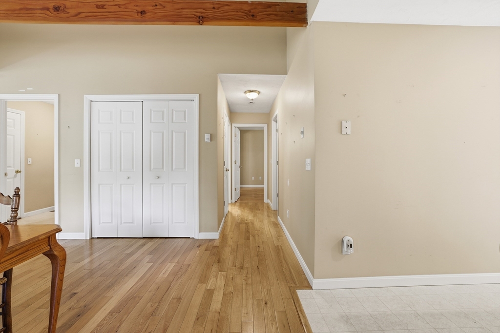 9 Rock Marsh Road, Unit B Wareham, MA 02571 - Photo 18 of 41 a view of a hallway with wooden floor