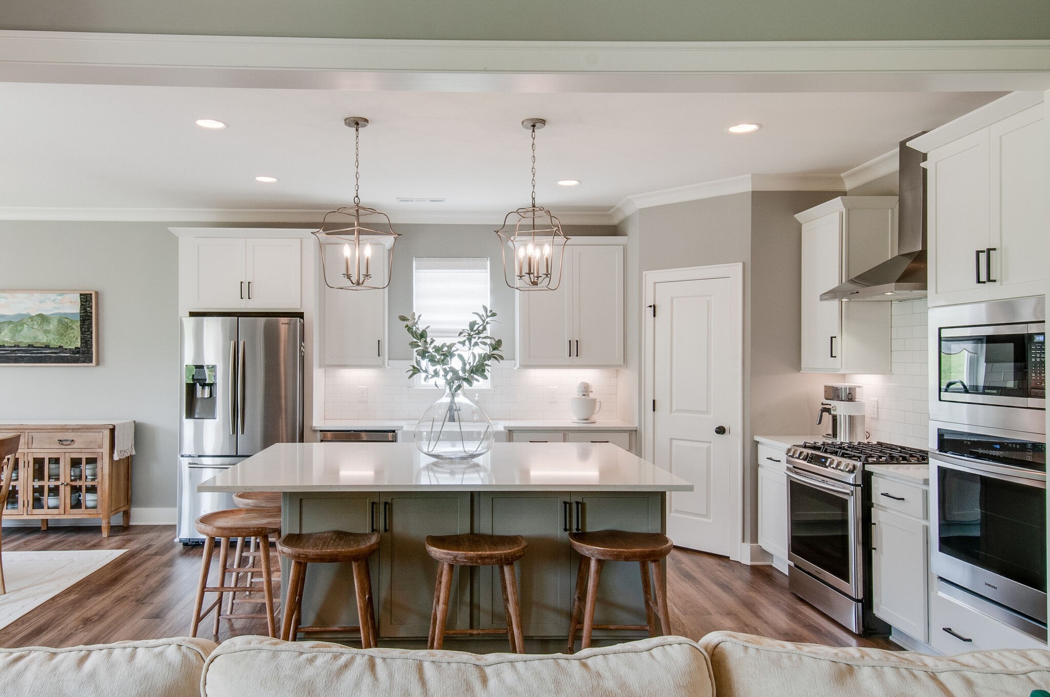 64 Haystack Way Mount Juliet, TN 37122 - Photo 12 of 41 a dining room with stainless steel appliances kitchen island granite countertop a dining table chairs and refrigerator