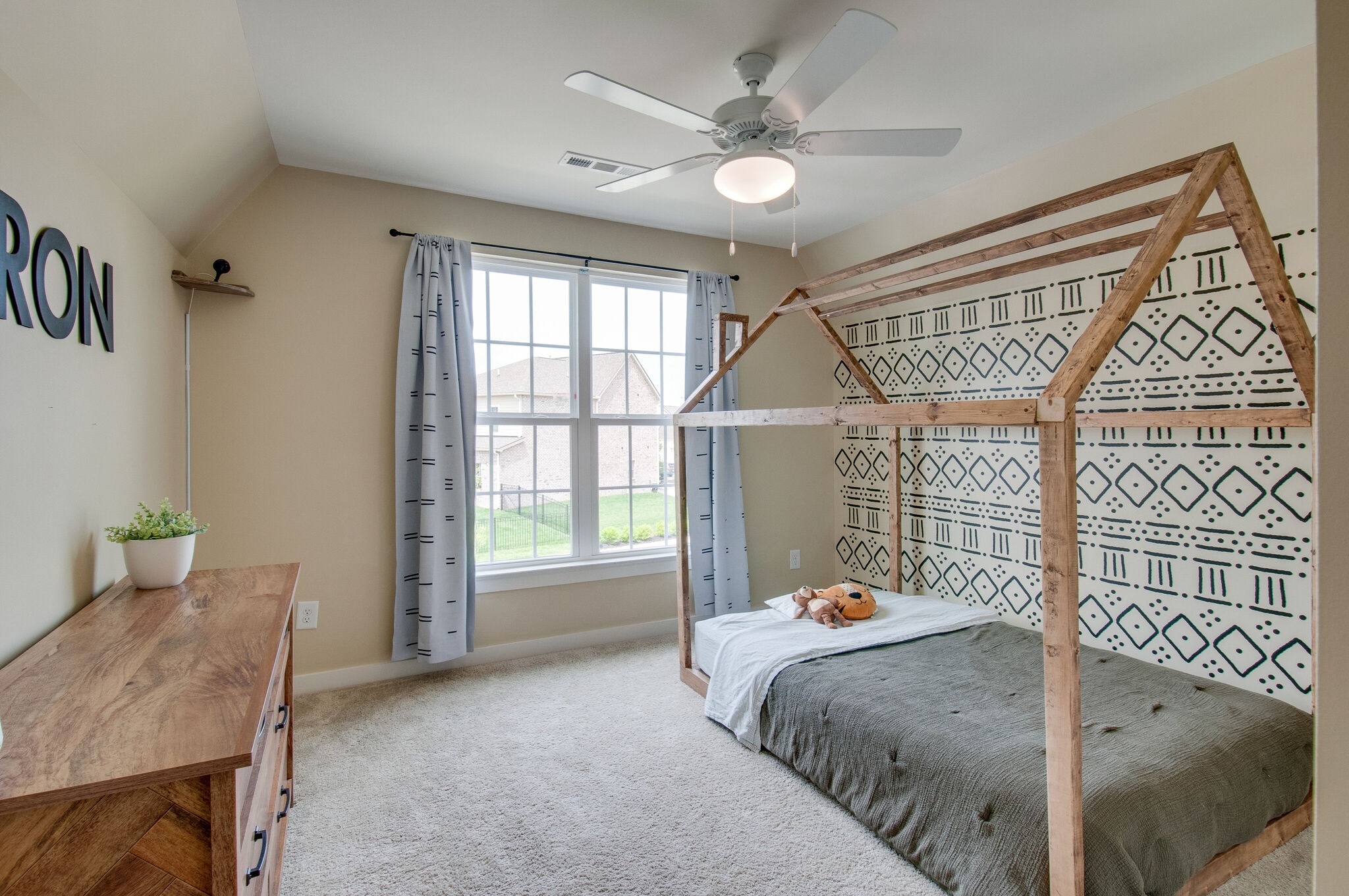 64 Haystack Way Mount Juliet, TN 37122 - Photo 30 of 41 a bedroom with a bed and a chandelier
