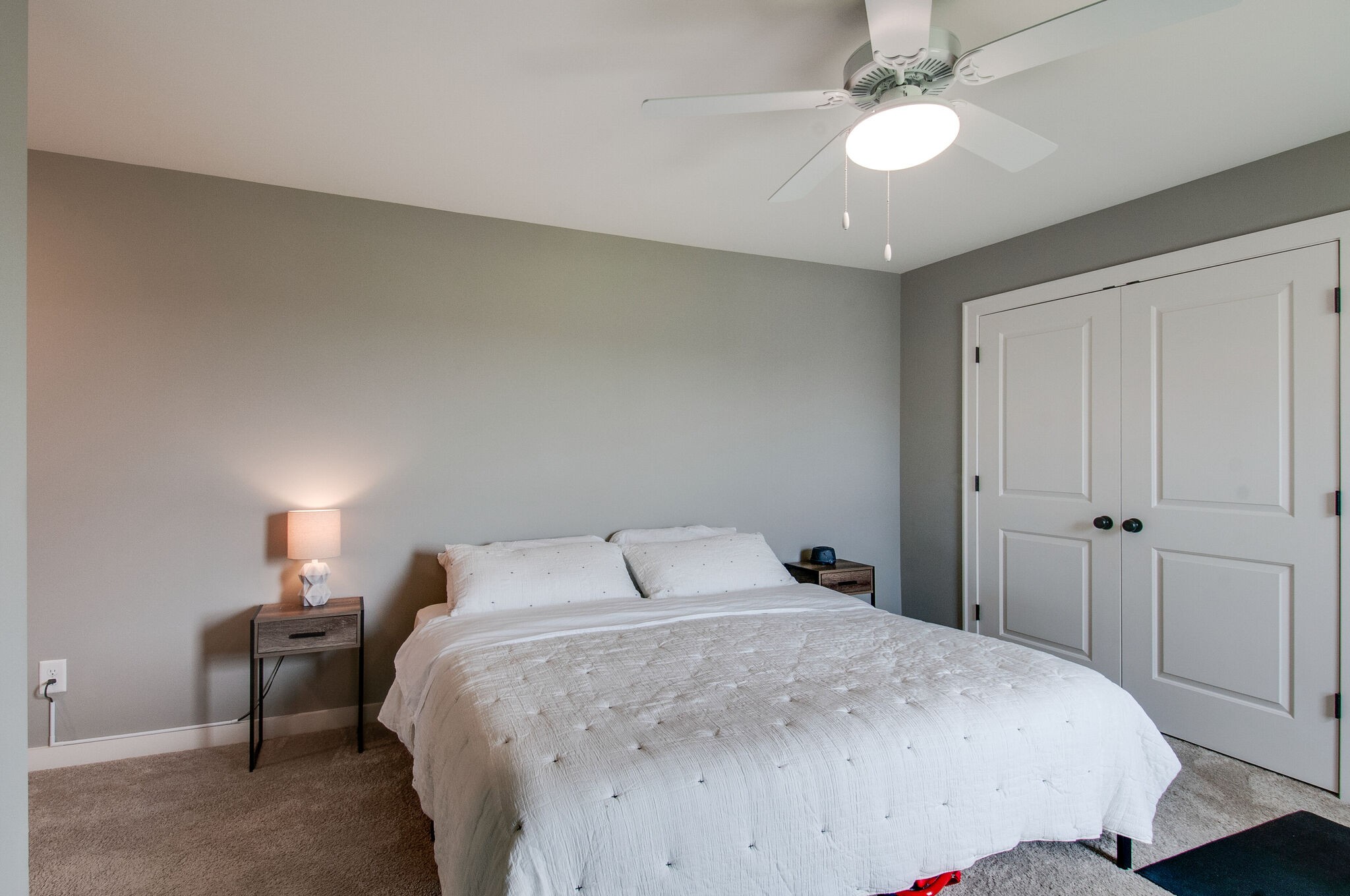 64 Haystack Way Mount Juliet, TN 37122 - Photo 35 of 41 a bedroom with a bed and a chandelier