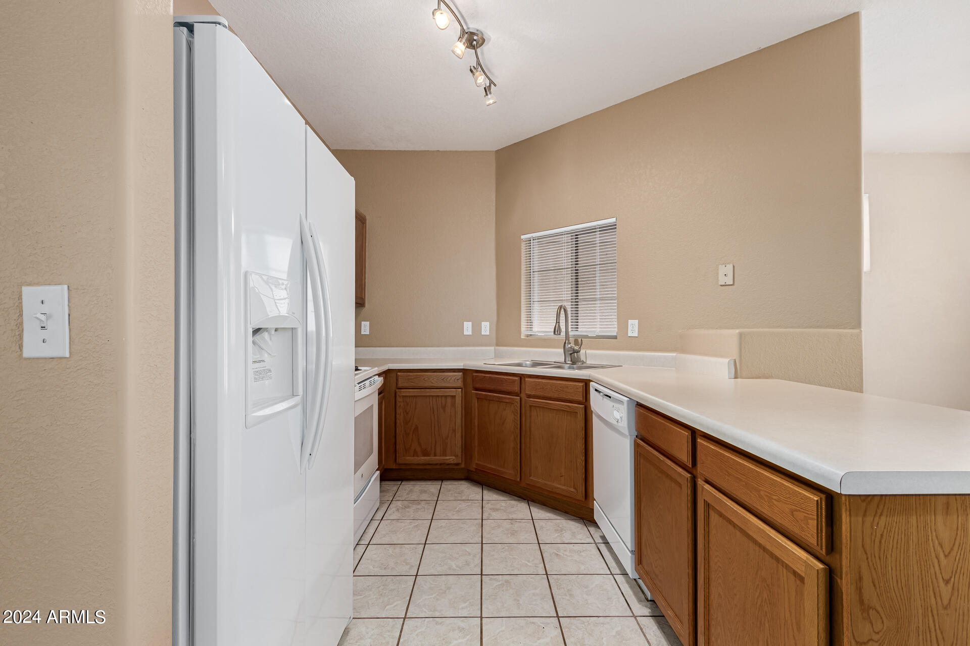 1371 South Boulder Street, Unit A Gilbert, AZ 85296 - Photo 16 of 43 a kitchen with a sink and cabinets