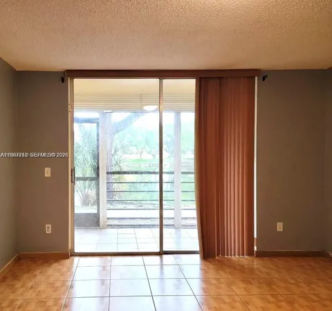 a view of a room with a large window