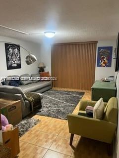 3253 Foxcroft Road, Unit G107 Miramar, FL 33025 - Photo 3 of 10 a living room with furniture and a window